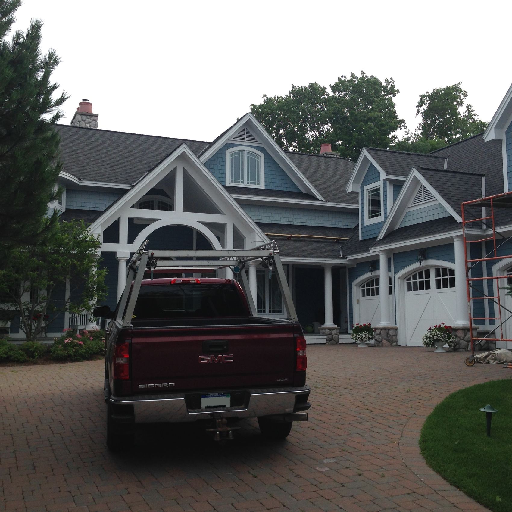 Exterior house painting on a large home in the Bay Harbor area