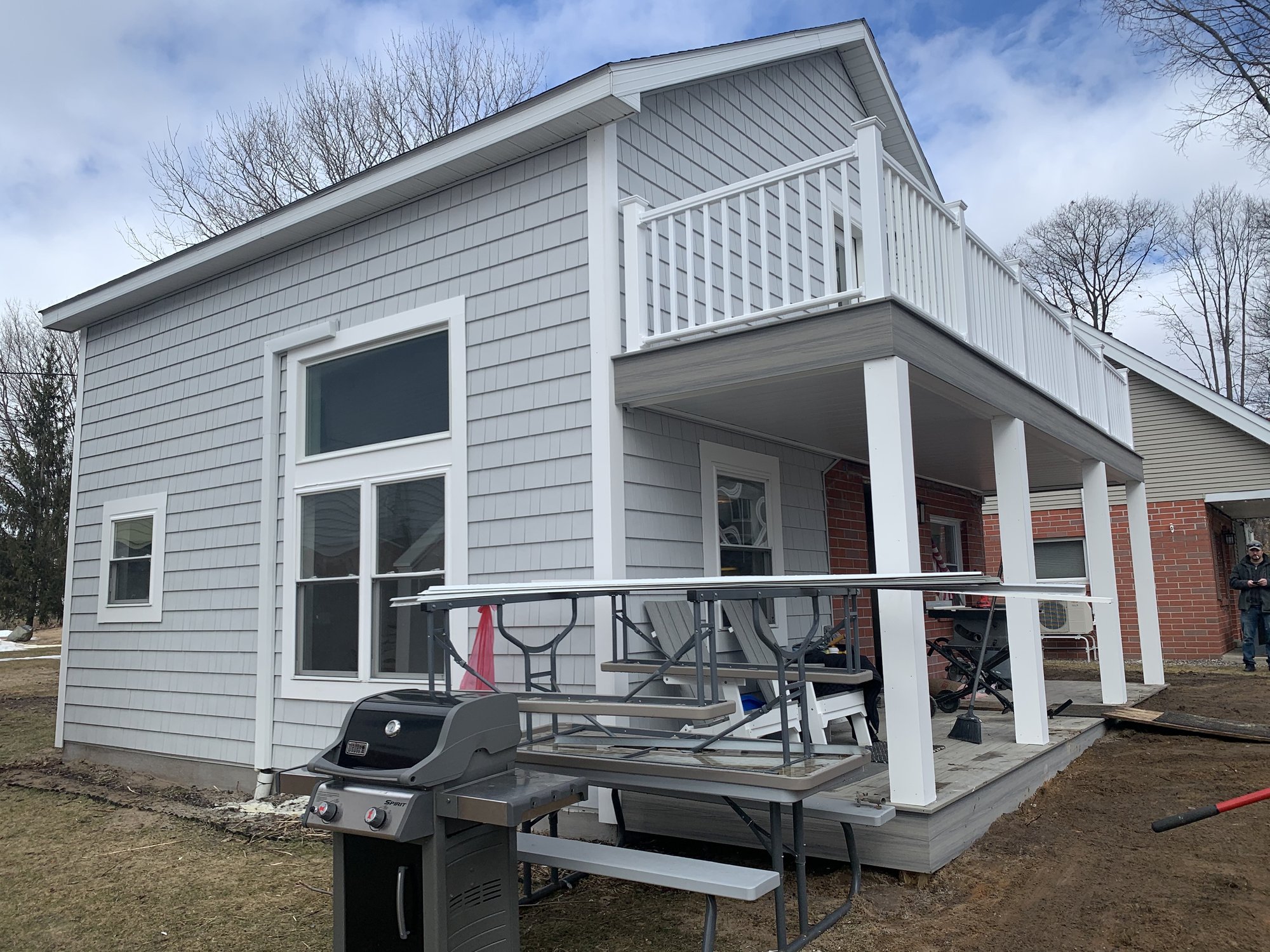 Gray home addition and exterior work by TNT Construction